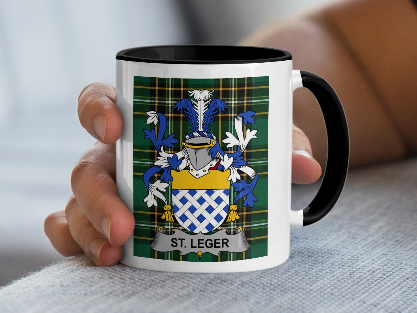 Mug with St. Leger crest on tartan background.