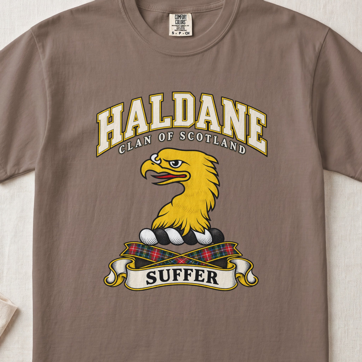 Haldane Scottish clan T-shirt in Espresso, front view with a gold eagle head and motto design.