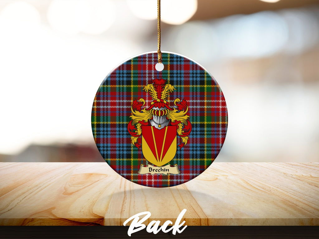 Round Brechin Scottish clan ornament with family crest on a Caledonia tartan background