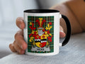 Mug with Hicks family crest on plaid background.