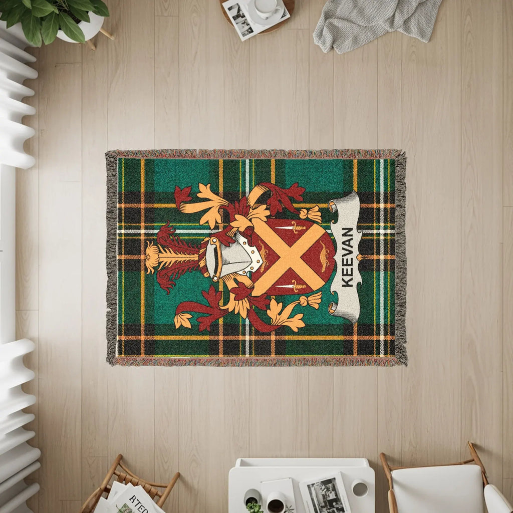 KEEVAN tartan blanket with a coat of arms in the center.