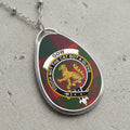 Gow clan Scottish tartan necklace with clan crest and Touch Not The Cat Bot A Glove motto on tartan background