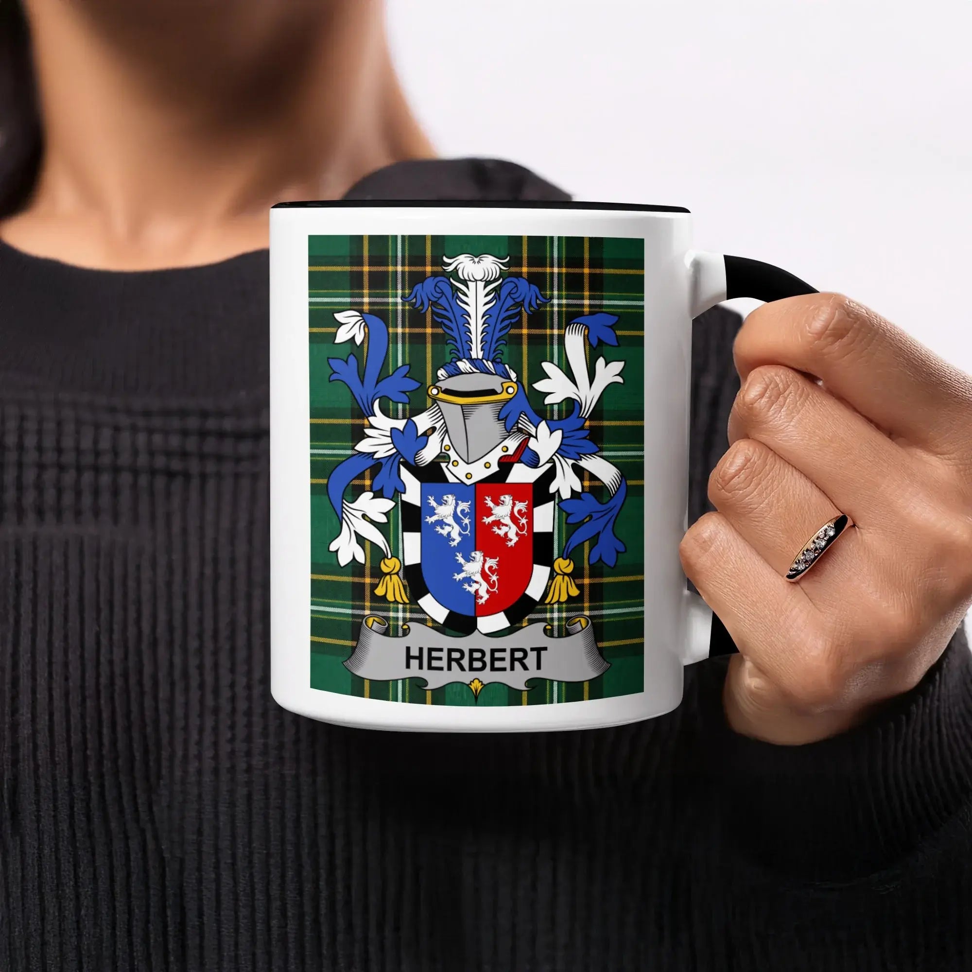 Mug with Herbert family crest on a green tartan background.