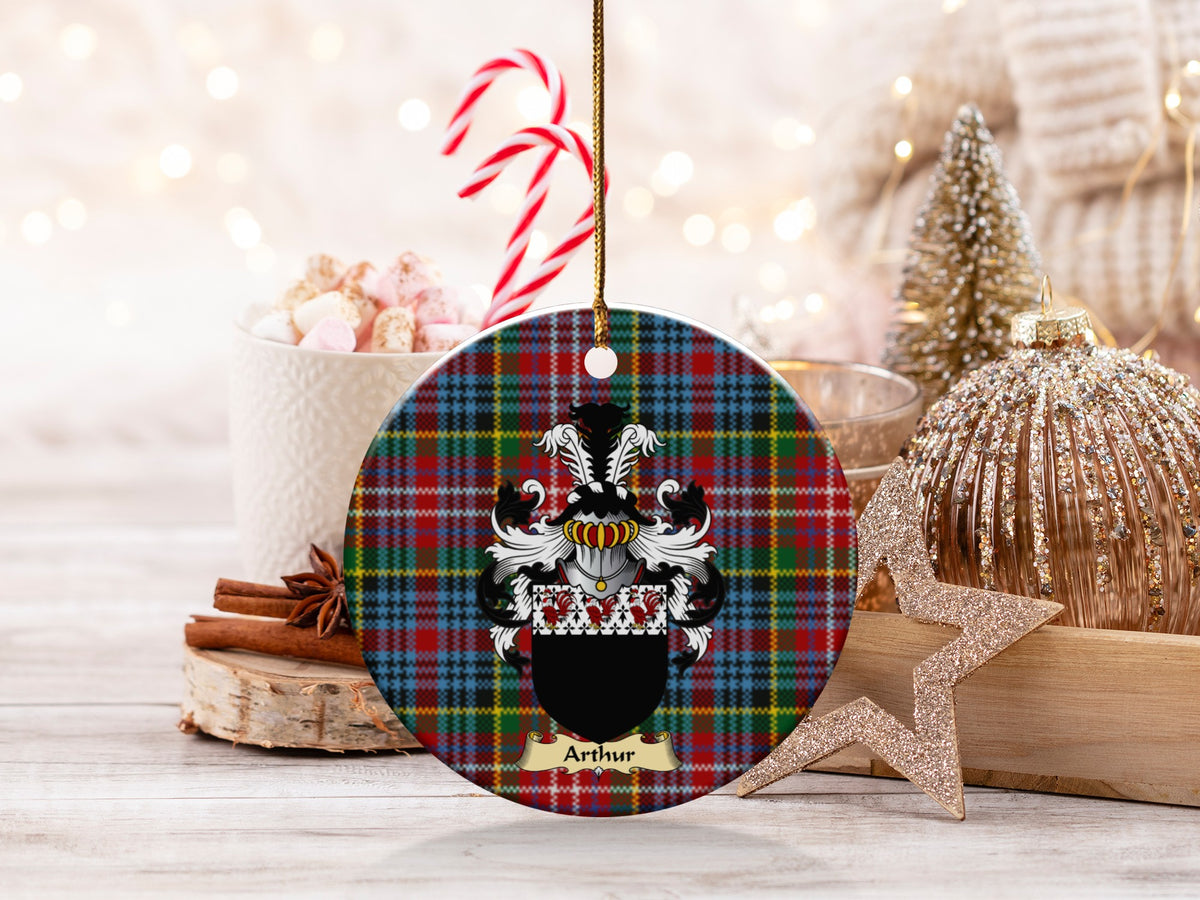 Arthur family emblem ceramic Christmas ornament with Caledonia tartan background in festive holiday décor