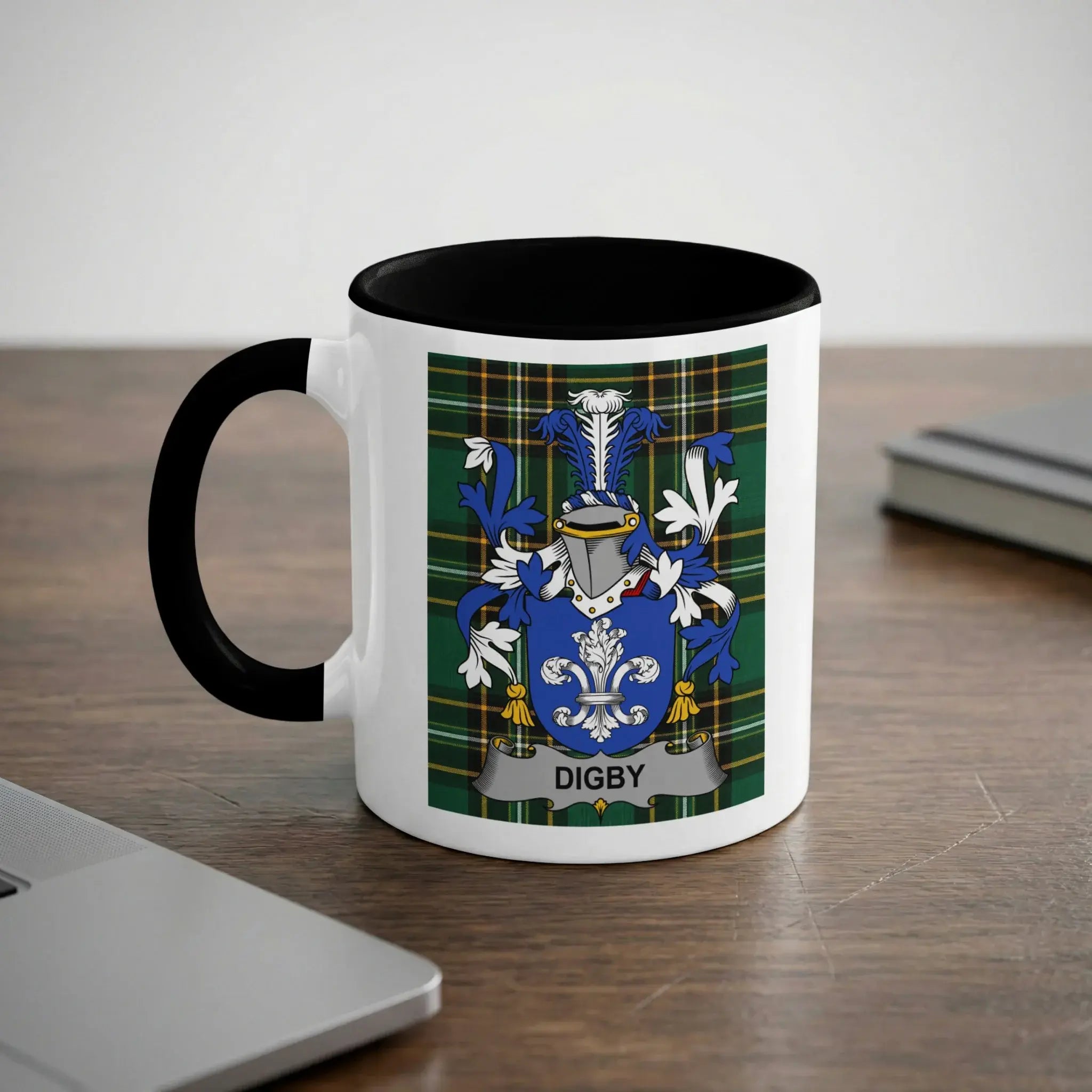 White mug with black handle featuring the Digby family crest on a green plaid background.