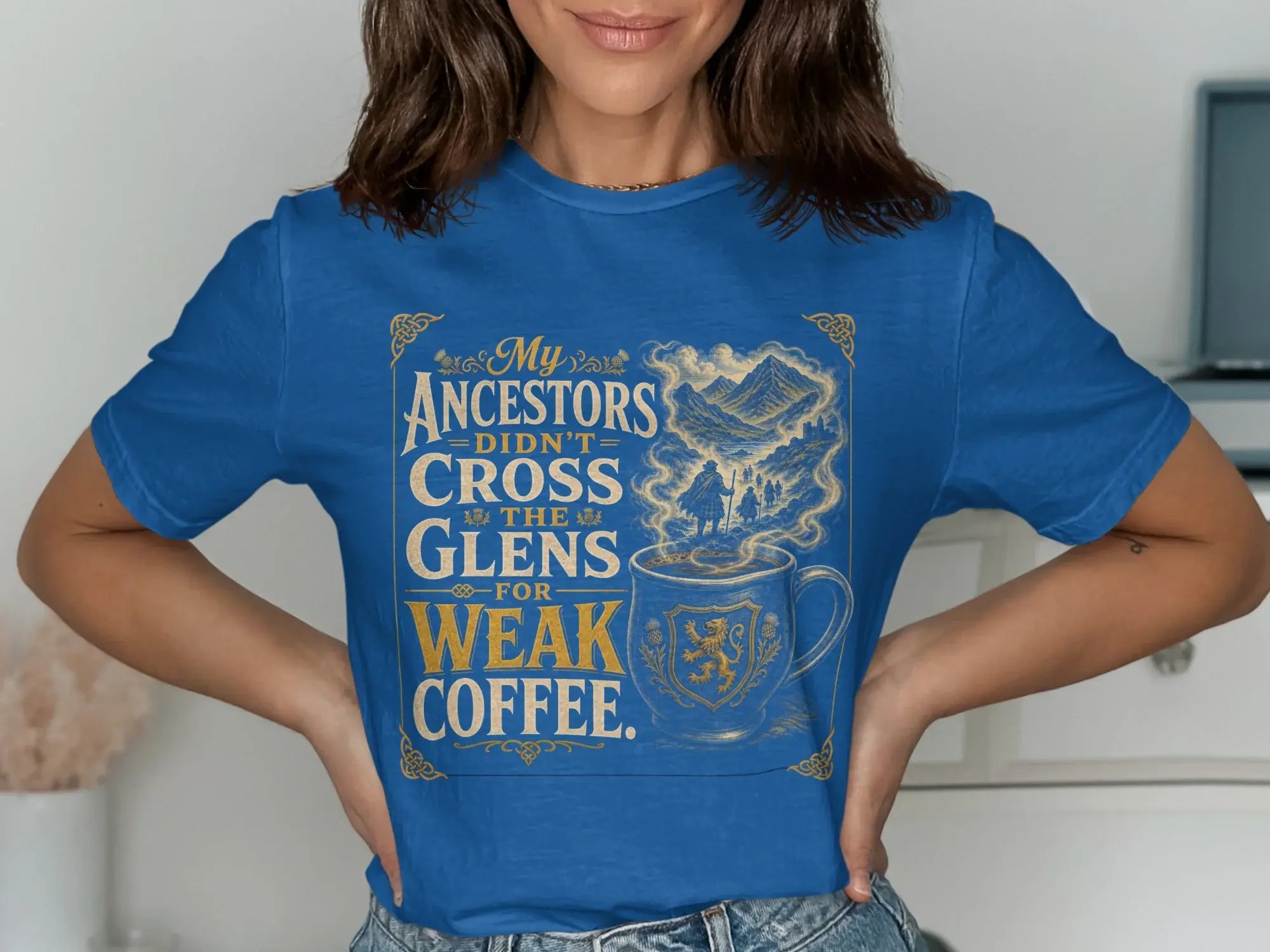 Blue t-shirt with "My Ancestors Didn't Cross The Glens For Weak Coffee" text and a mug design.