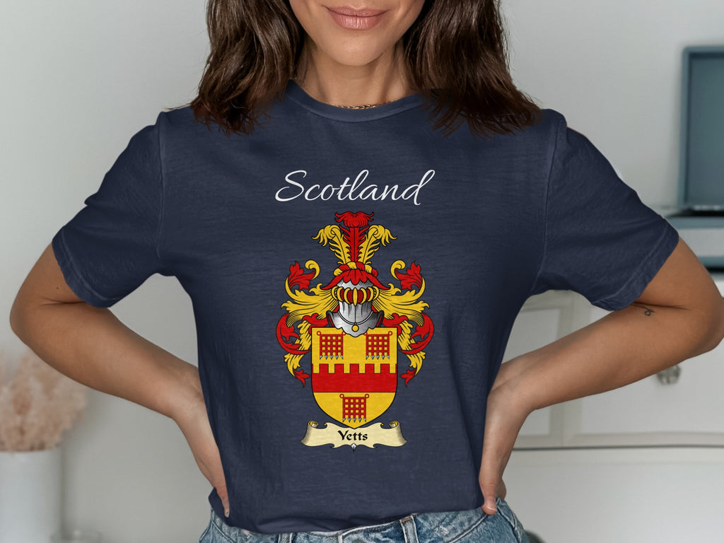 Model wearing the navy Yetts family crest T-shirt featuring “Scotland” and the surname banner.