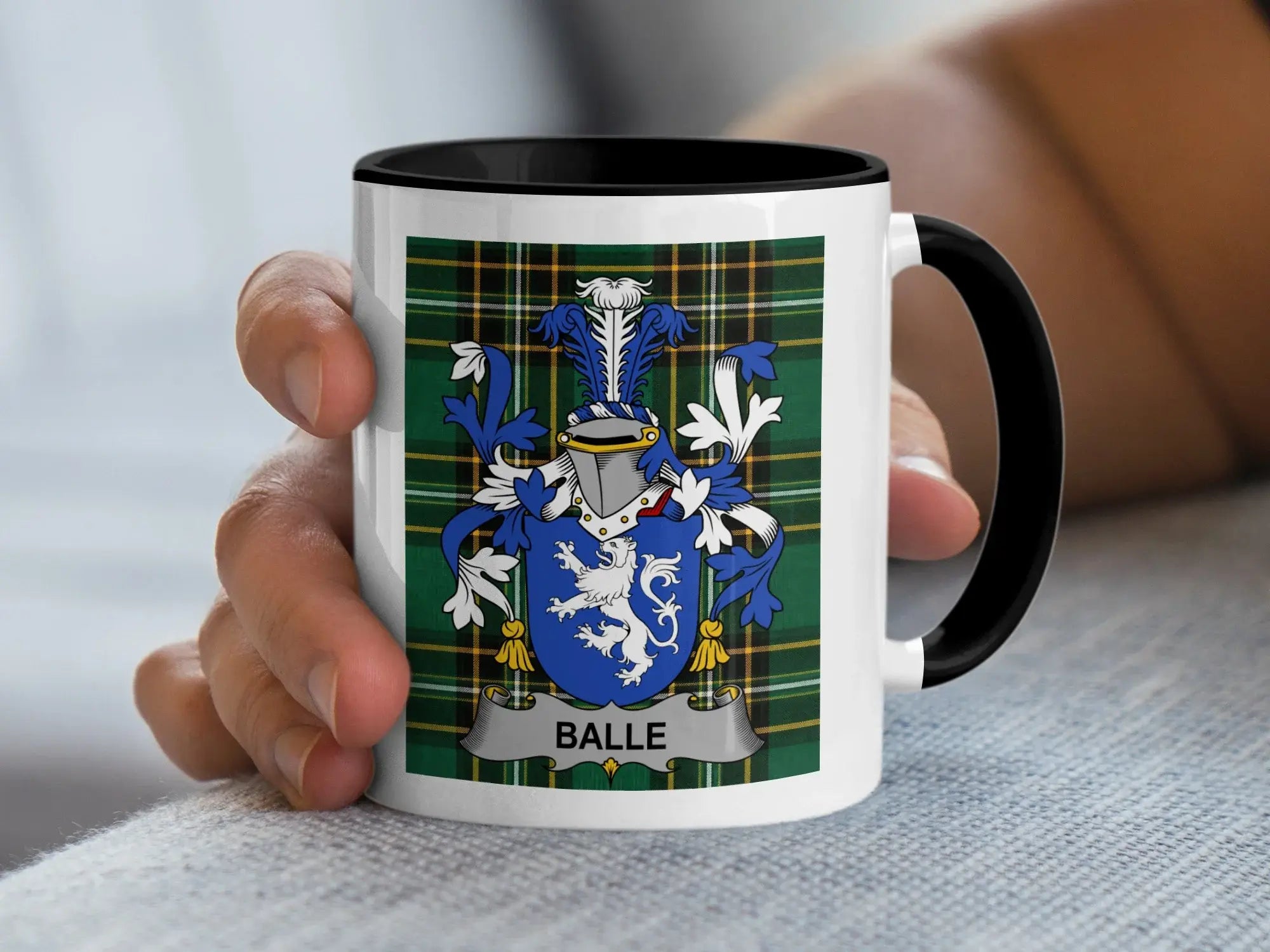 Mug with the Balle family crest on a plaid background.