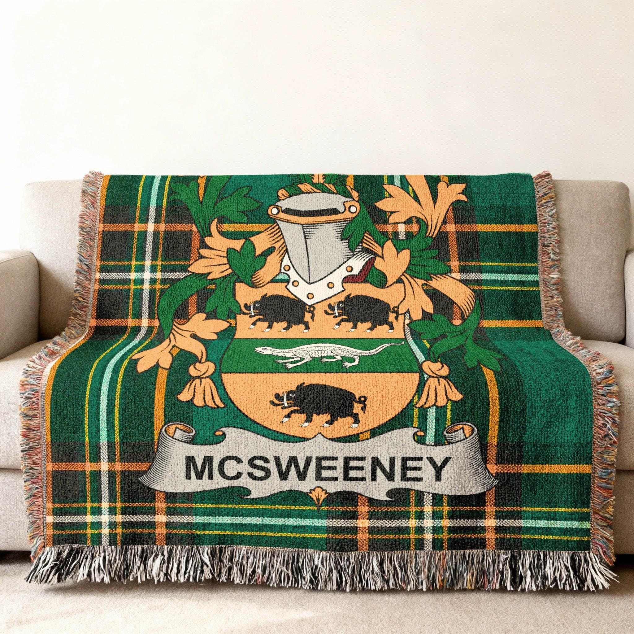 McSweeney family crest on a tartan throw blanket with tassels.