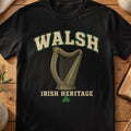 Walsh Irish harp T-shirt in Black, with cream surname lettering, a gold-toned harp, green shamrock and “Irish Heritage” text.
