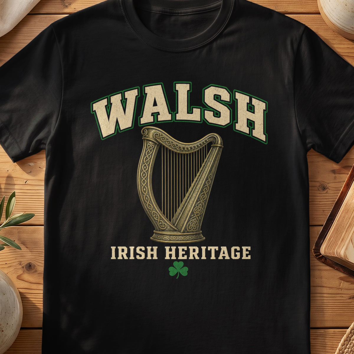Walsh Irish harp T-shirt in Black, with cream surname lettering, a gold-toned harp, green shamrock and “Irish Heritage” text.