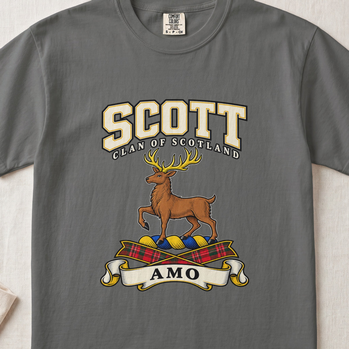 Scott graphic T-shirt in Pepper gray, front flat lay showing varsity lettering and brown stag with gold antlers and one raised front leg.