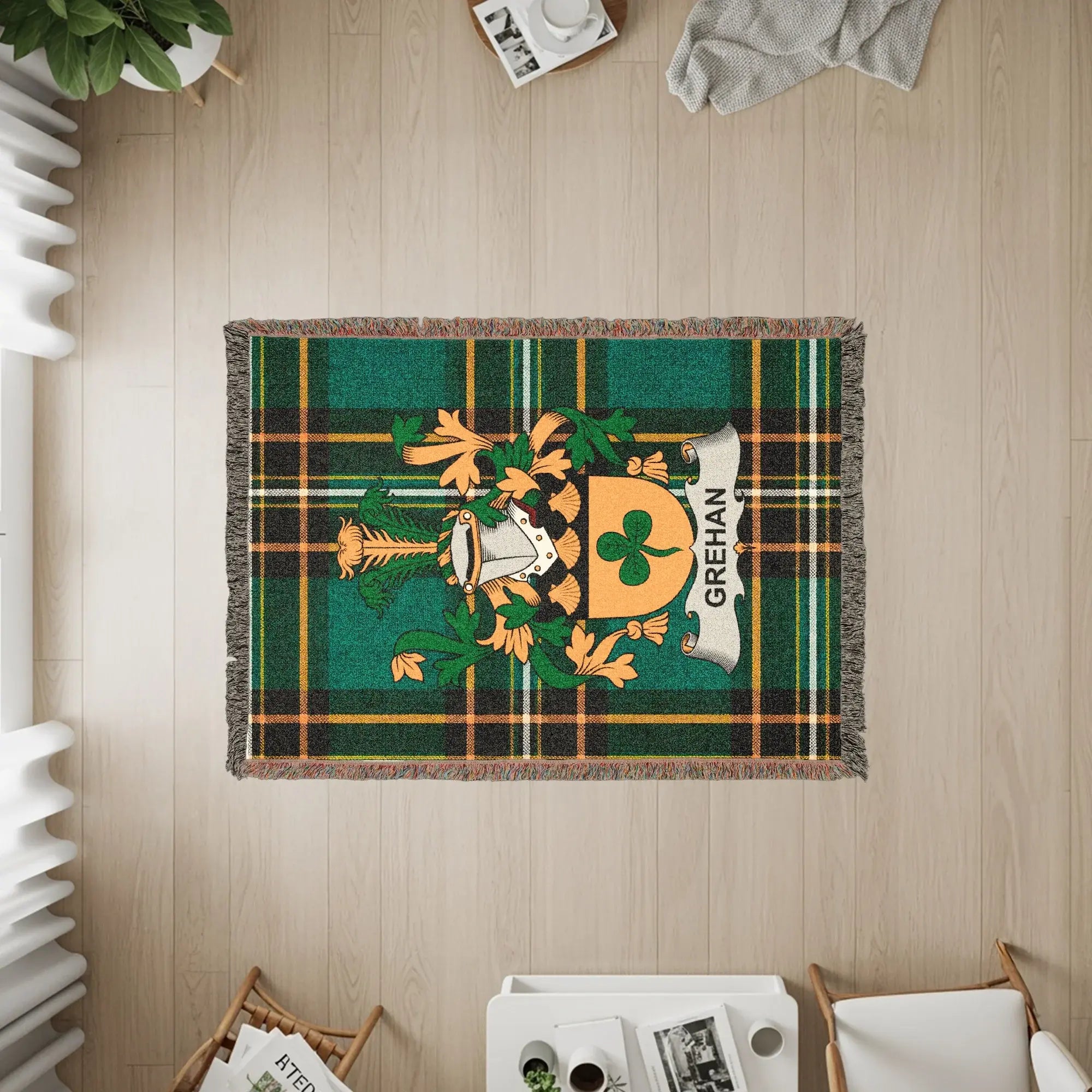 Green plaid throw blanket with Grehan family crest.