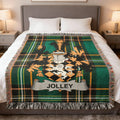 Green plaid throw blanket with a lion crest and "JOLLEY" banner.