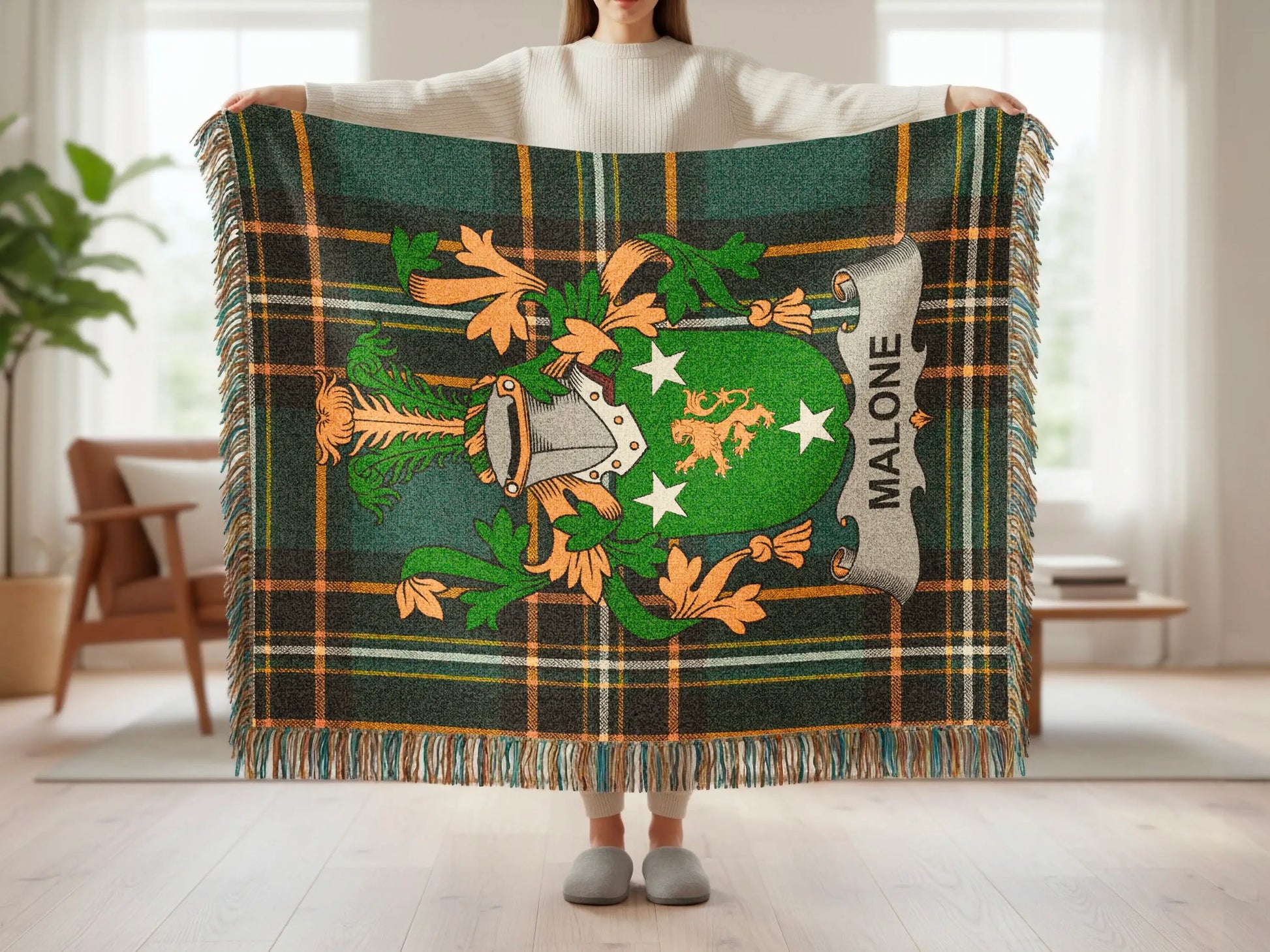 Green plaid throw blanket with the Malone family crest.