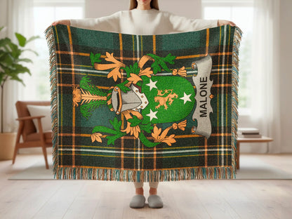 Green plaid throw blanket with the Malone family crest.