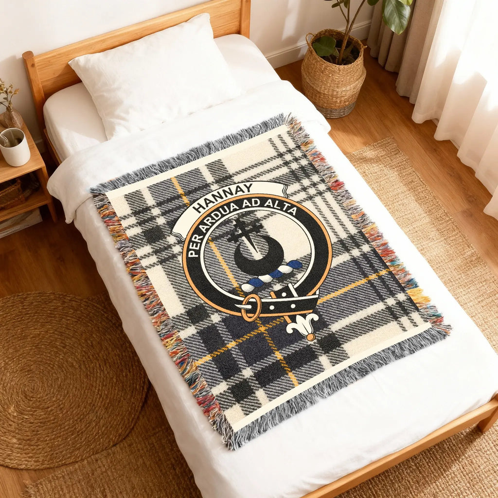 Hannay tartan woven blanket — close-up of clan crest and Per Ardua Ad Alta motto in weave