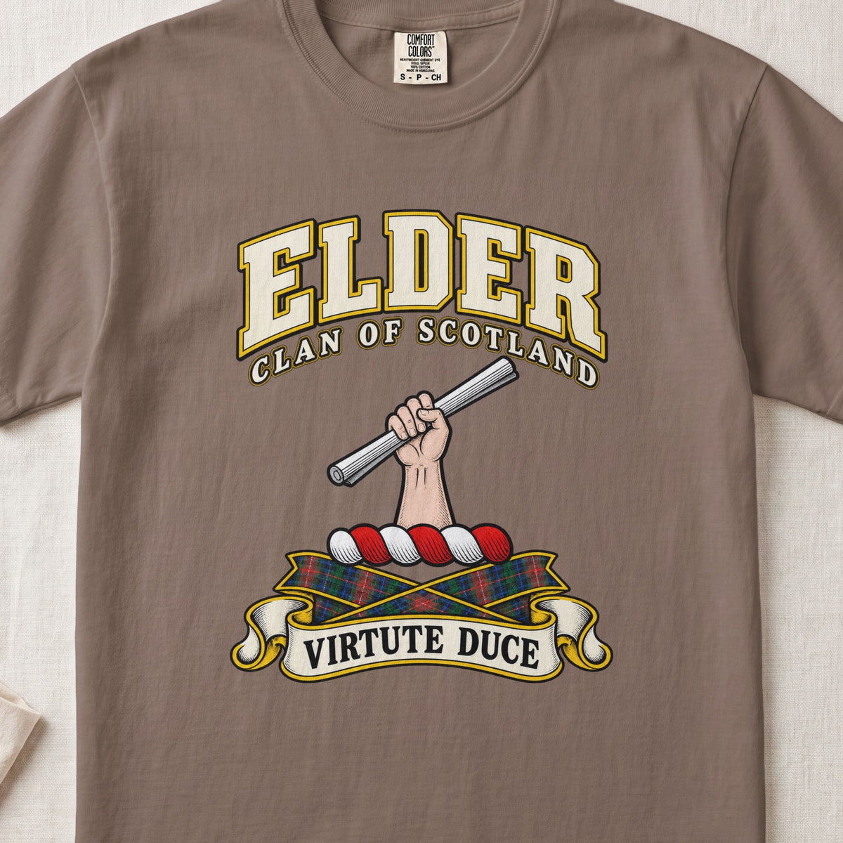 Elder Scottish clan T-shirt in Espresso, front view with a hand holding a silver rod and motto banner.