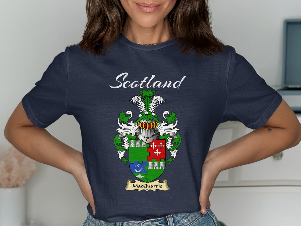 Model wearing a navy MacQuarrie T-shirt featuring a green shield with contrasting coloured quarters