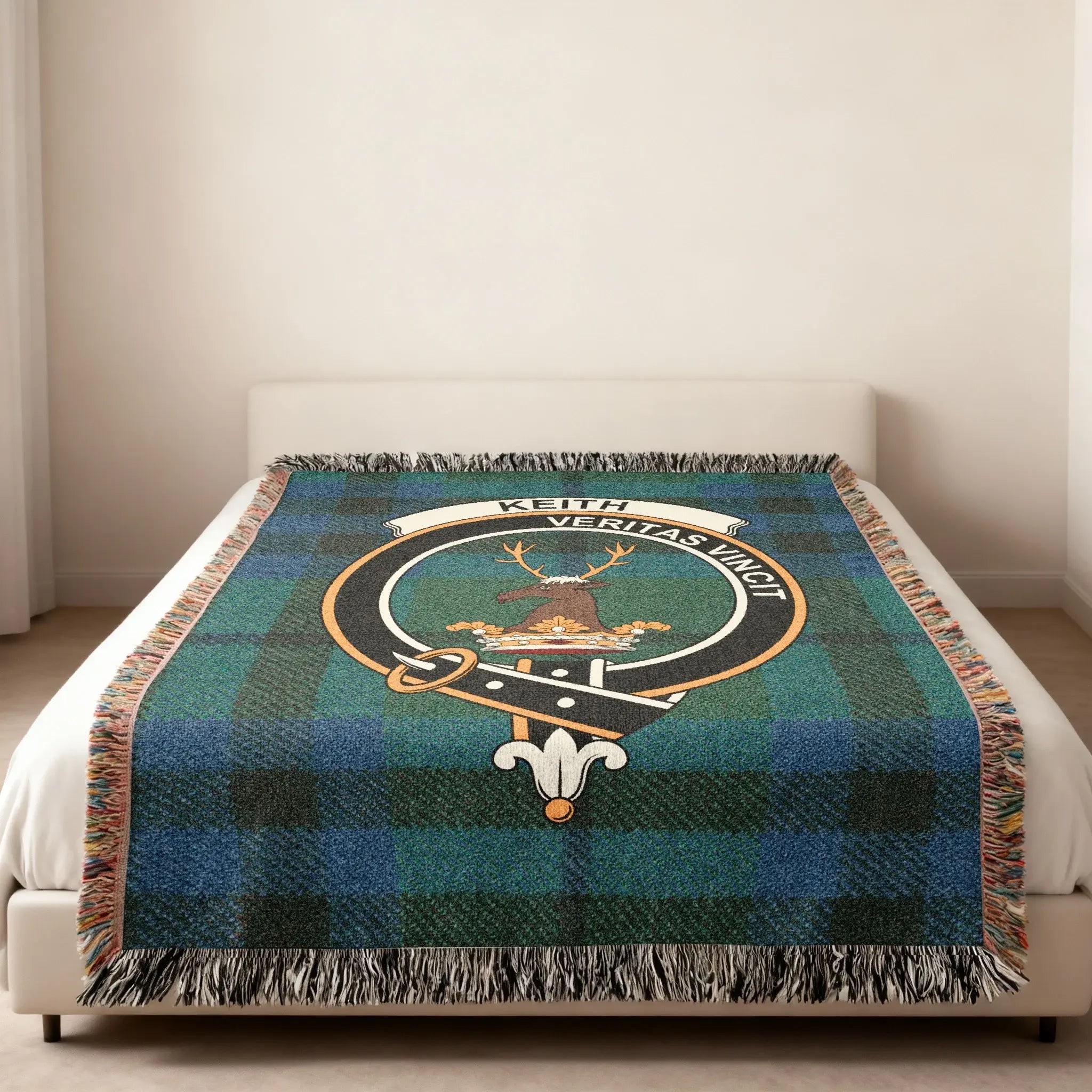 Keith Veritas Vincit tartan woven blanket — heraldic design at centre, fringe edge visible