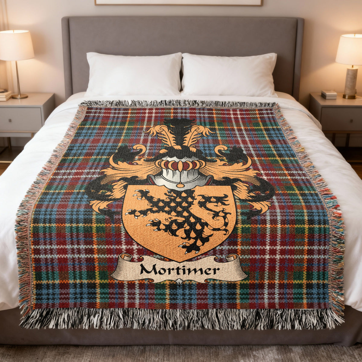 Mortimer family crest emblem on a Caledonia tartan woven blanket