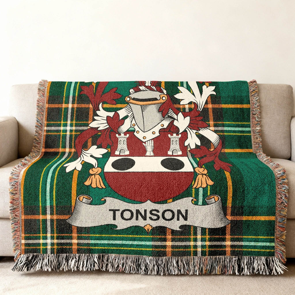 Green tartan throw blanket with Tonson family crest.