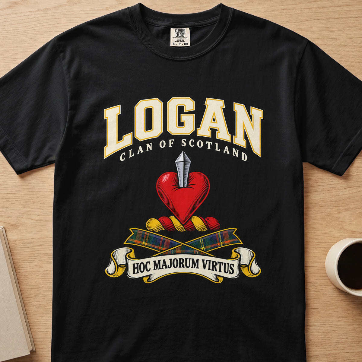 Logan clan crest with red heart and silver blade on a black Comfort Colors T-shirt, front view