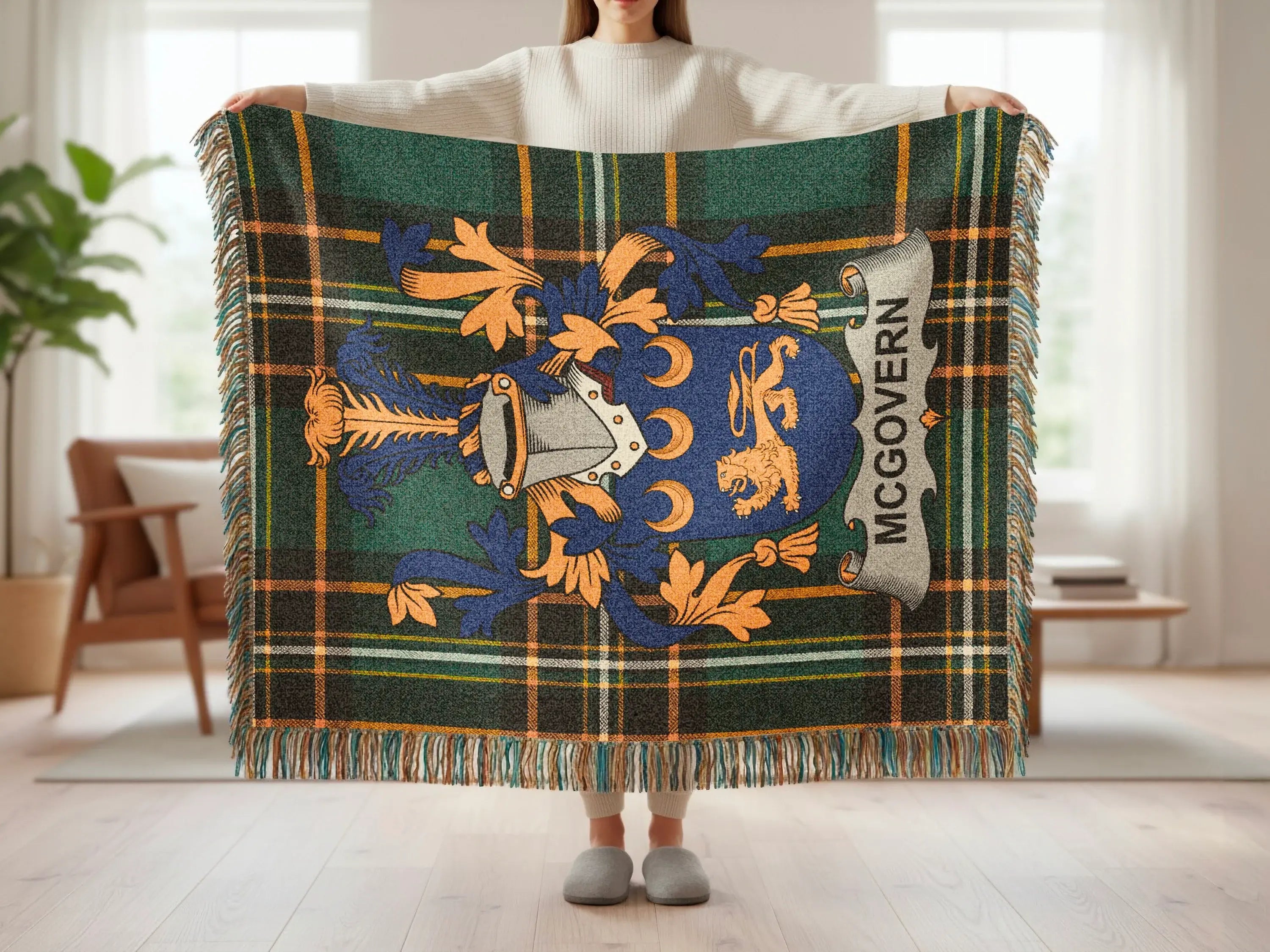 McGovern crest on green plaid tartan blanket with fringe.