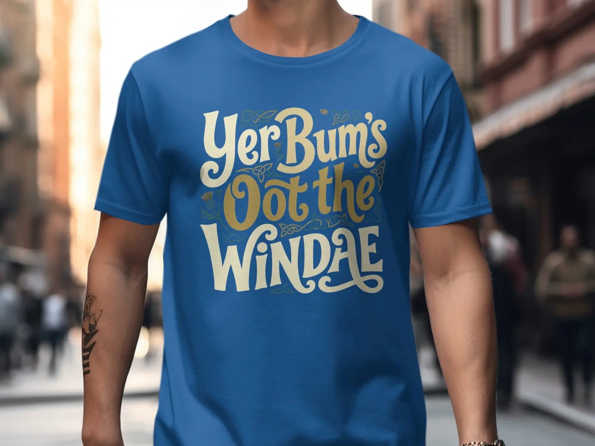 Blue t-shirt with white text "Yer Bum's Oot the Windae".