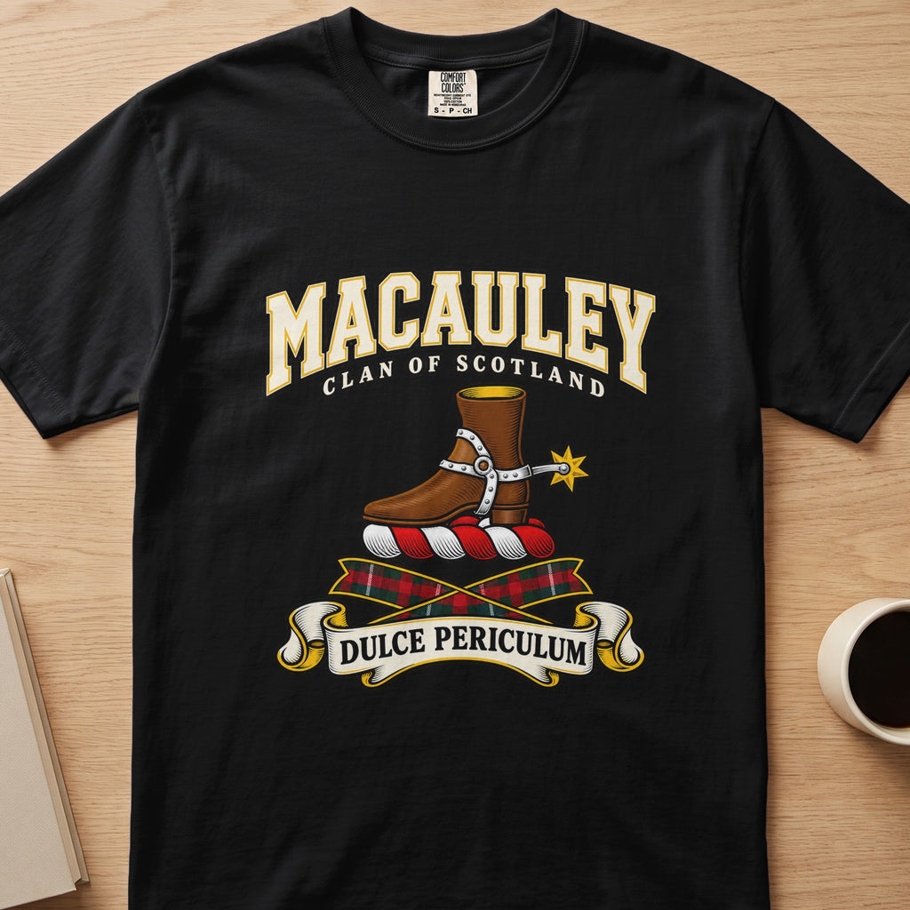 MacAuley brown boot and gold spur crest graphic on a black Comfort Colors T-shirt, front view