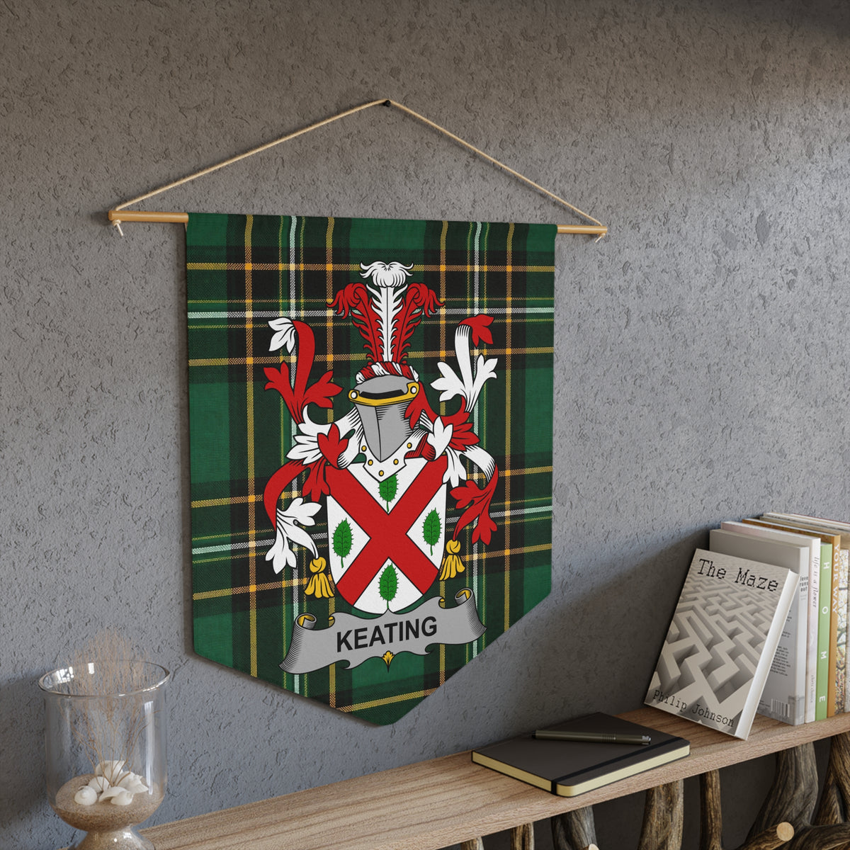Keating family crest pennant on the Irish National Tartan hanging on a wall above books