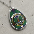 Davidson clan Scottish tartan necklace with clan crest on tartan background