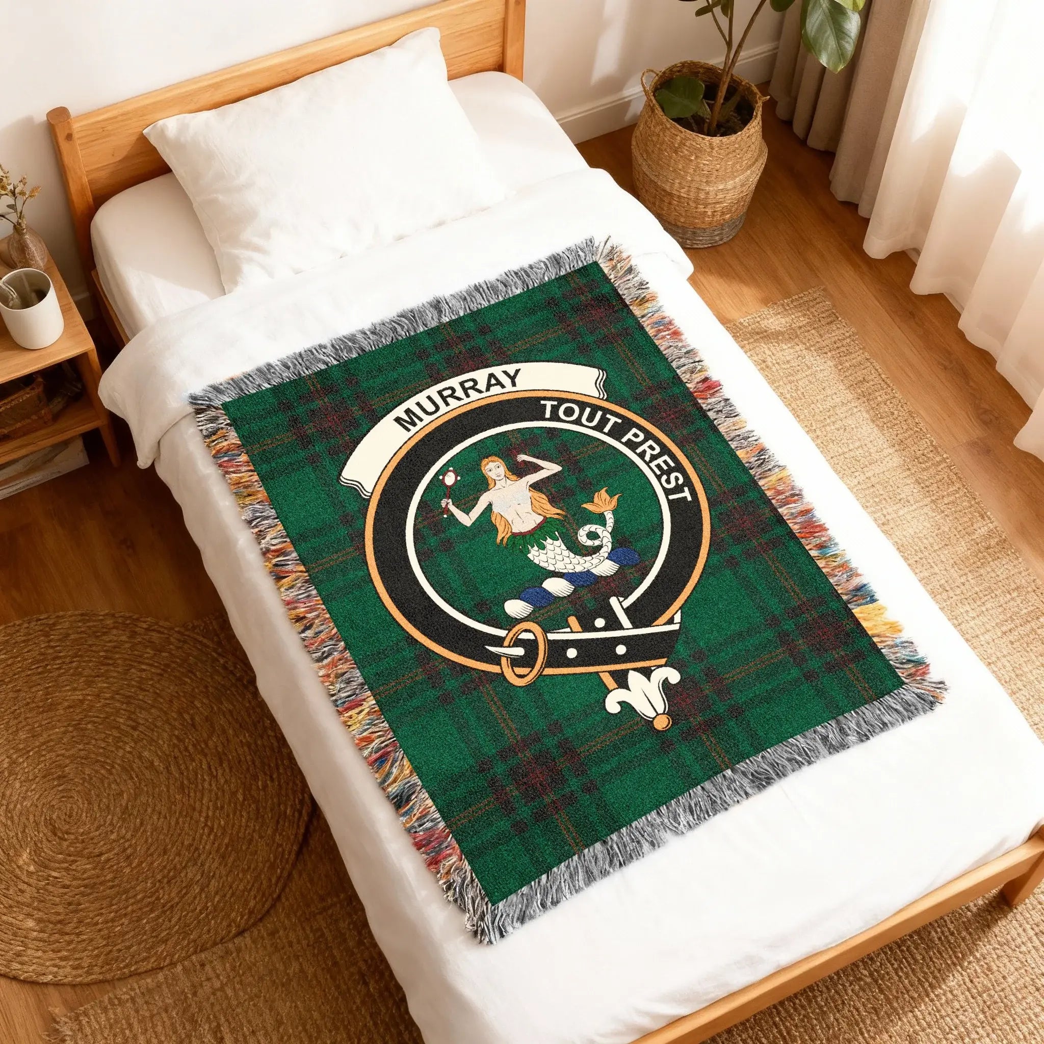 Murray Tout Prest tartan woven blanket on sofa — clan colours in cotton throw