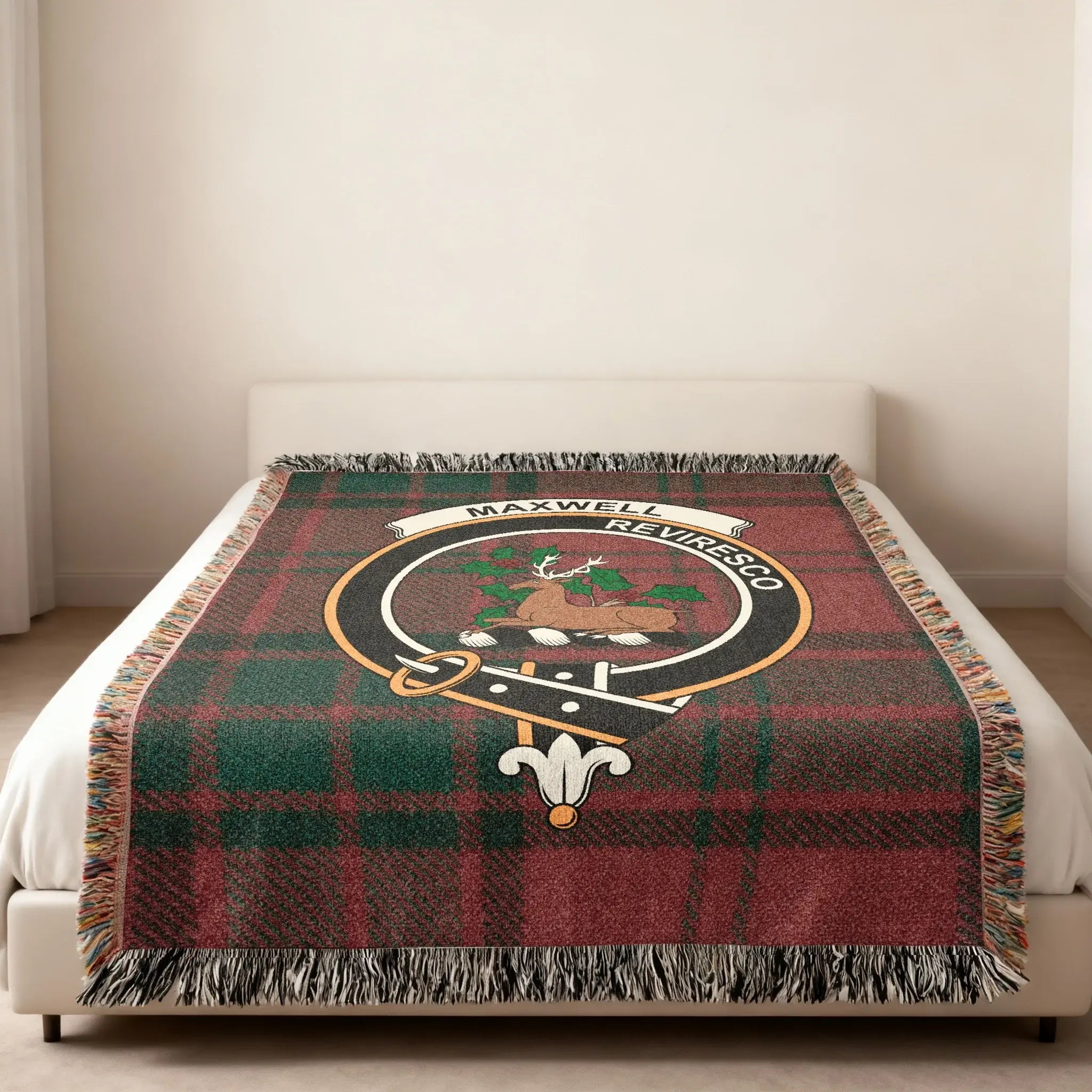 Maxwell clan tartan woven blanket folded — Reviresco stag crest on cotton with fringe edge detail