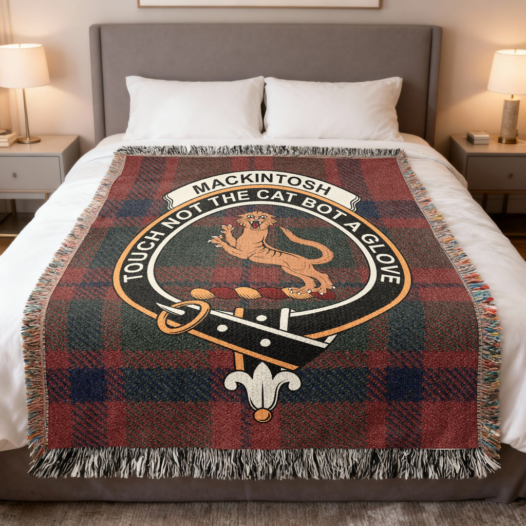 Mackintosh clan crest tartan woven blanket draped on a bed — 100% cotton