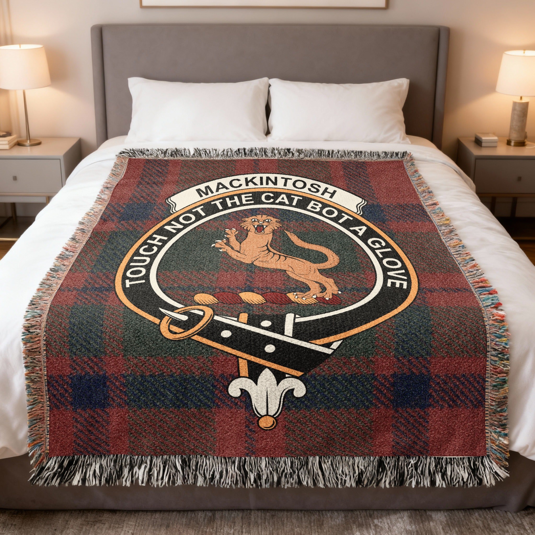 Mackintosh clan crest tartan woven blanket draped on a bed — 100% cotton