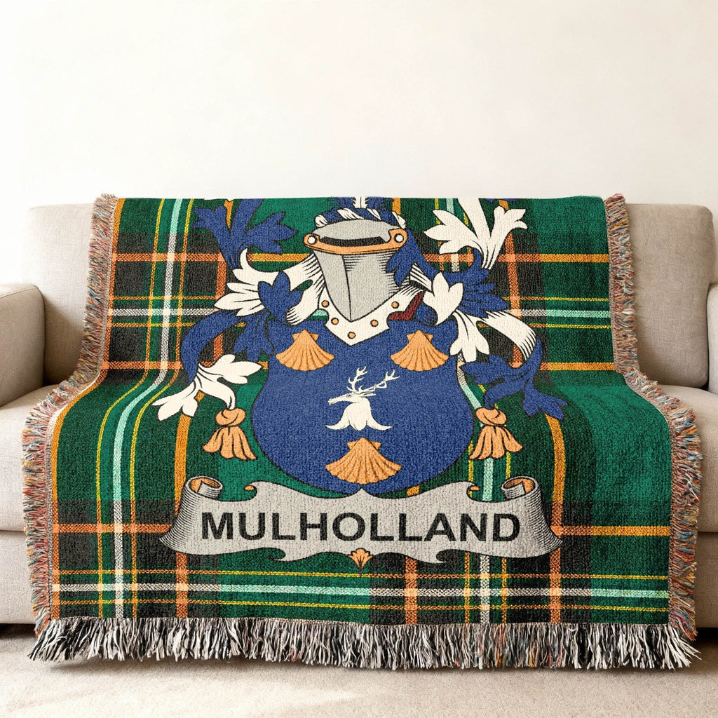 Green tartan blanket with the Mulholland family crest displayed centrally.