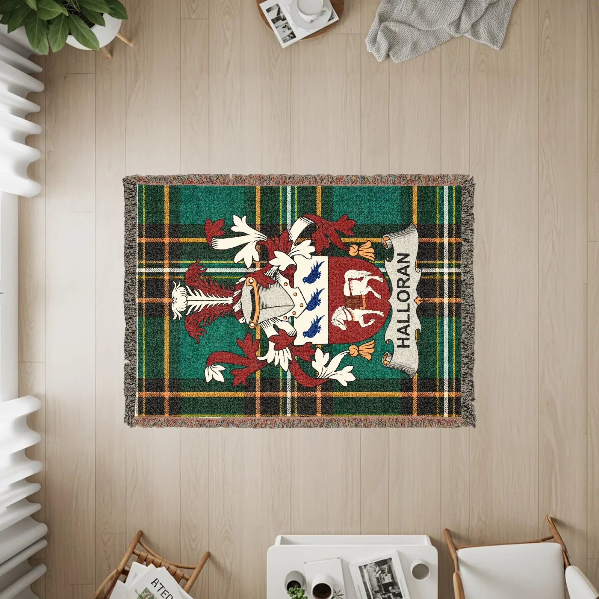 Halloran clan crest on a tartan plaid woven throw blanket.