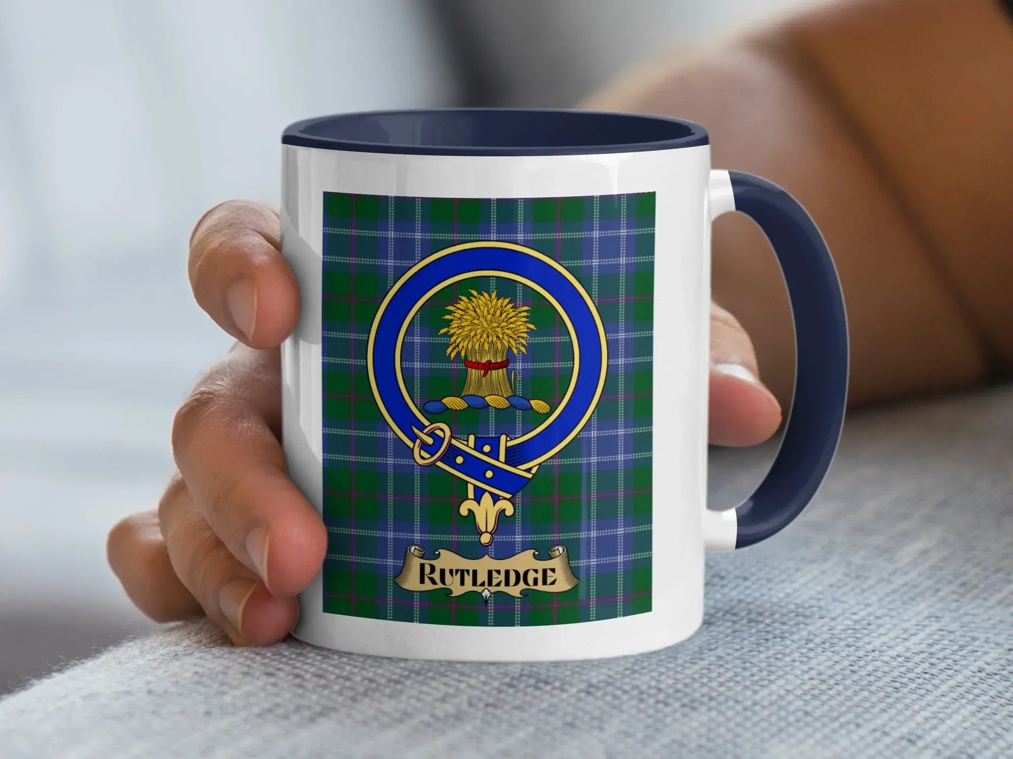 Rutledge family crest coffee mug with a tartan-background design