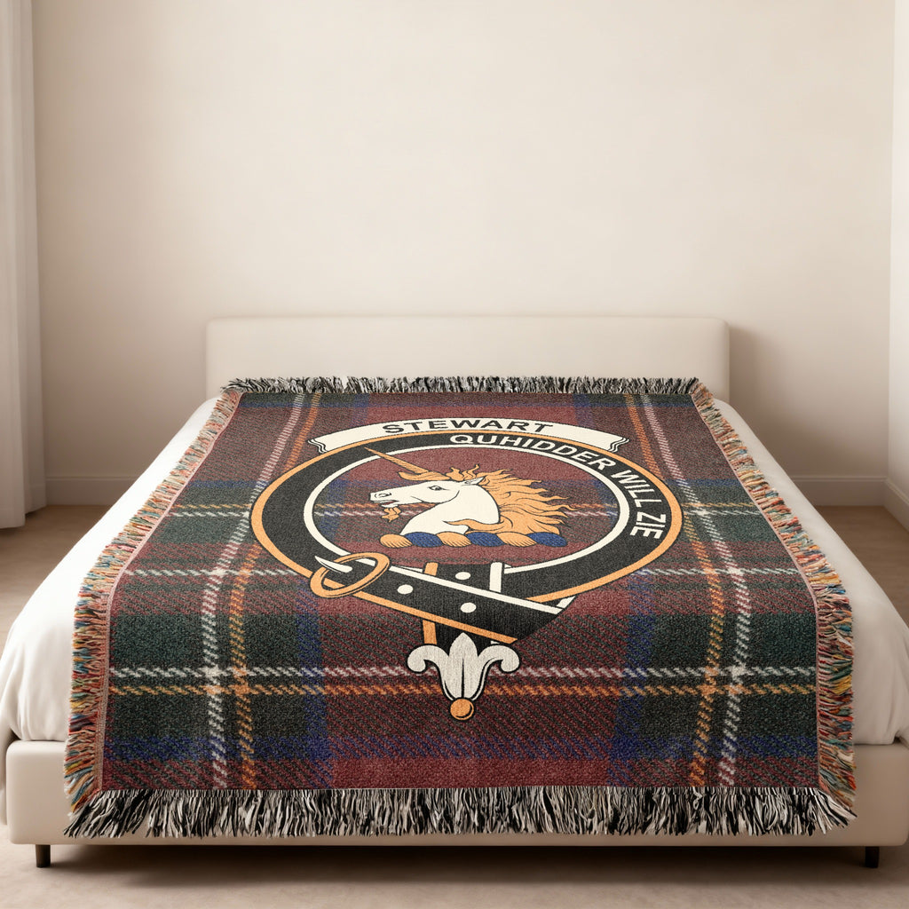 Stewart of Appin Scottish woven blanket spread across a bed, showing the full crest design and tartan background