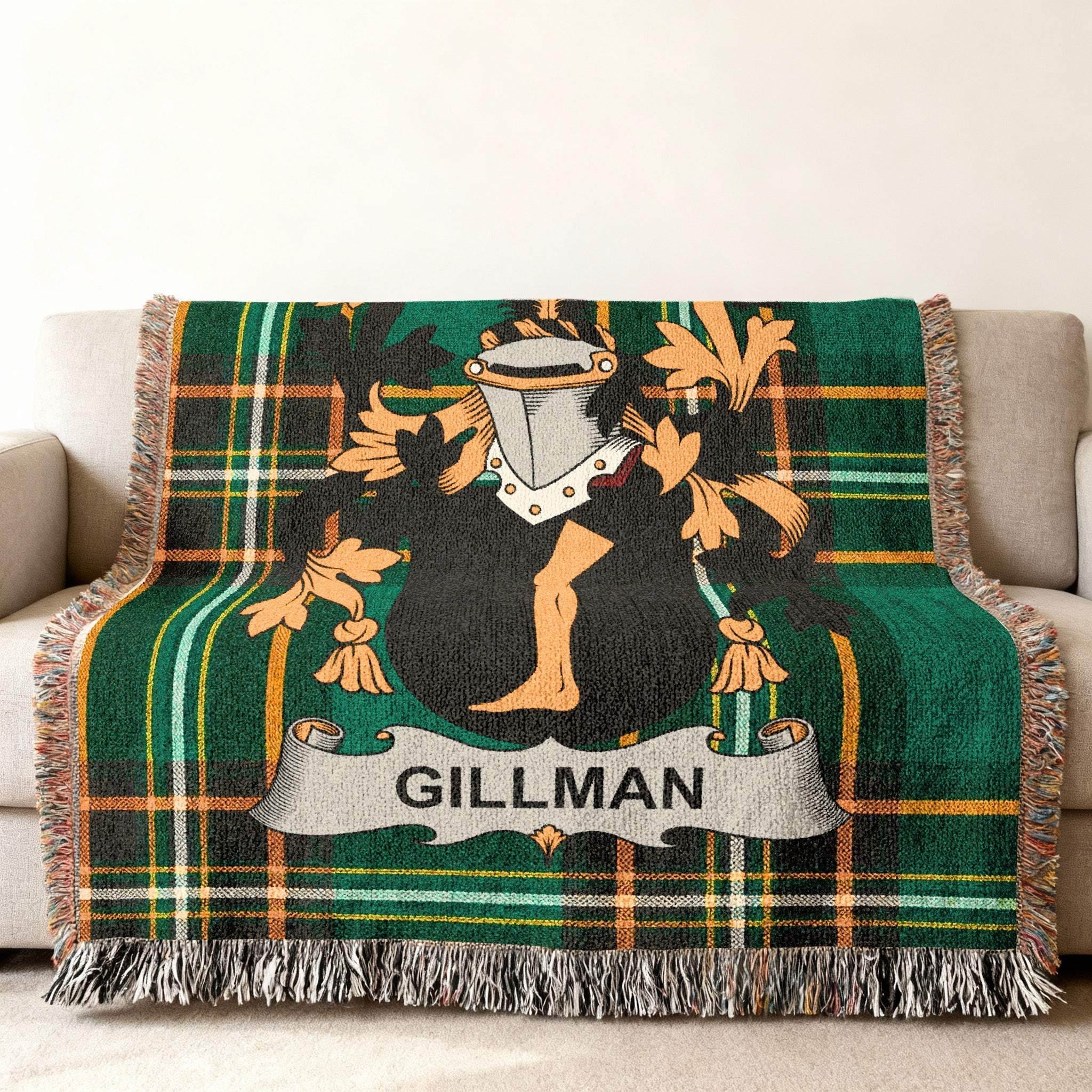 Gillman family crest on a green tartan plaid throw blanket.