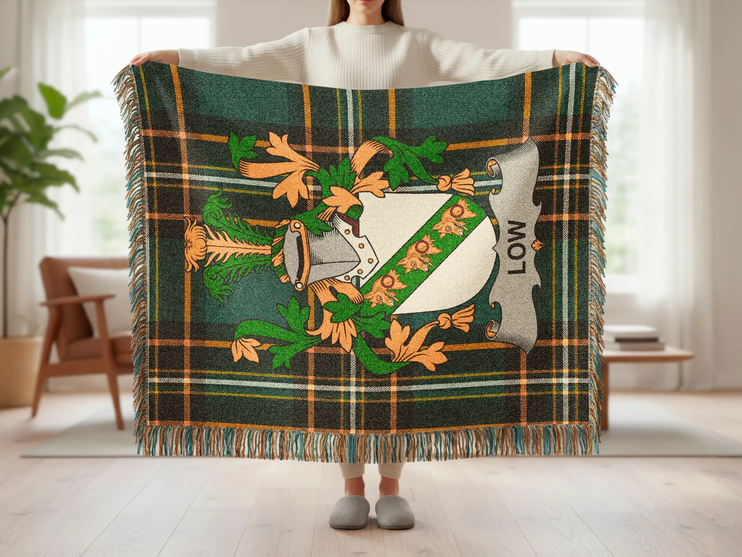 Tartan blanket featuring a family crest with the name "LOW" above it.