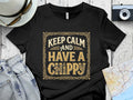 Black t-shirt with "Keep Calm and Have a Chippy" text in ornate gold font.