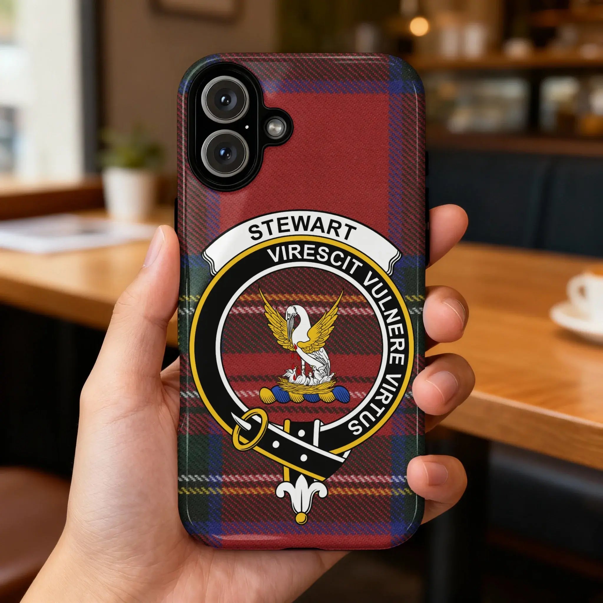 Clan Stewart virescit vulnere virtus tartan phone case — glossy edge-to-edge crest print, iPhone shown