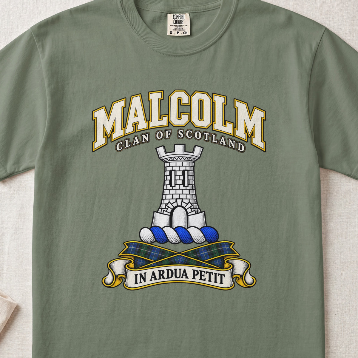 Malcolm Scottish clan T-shirt in Moss, front view with a gray stone tower and motto banner.