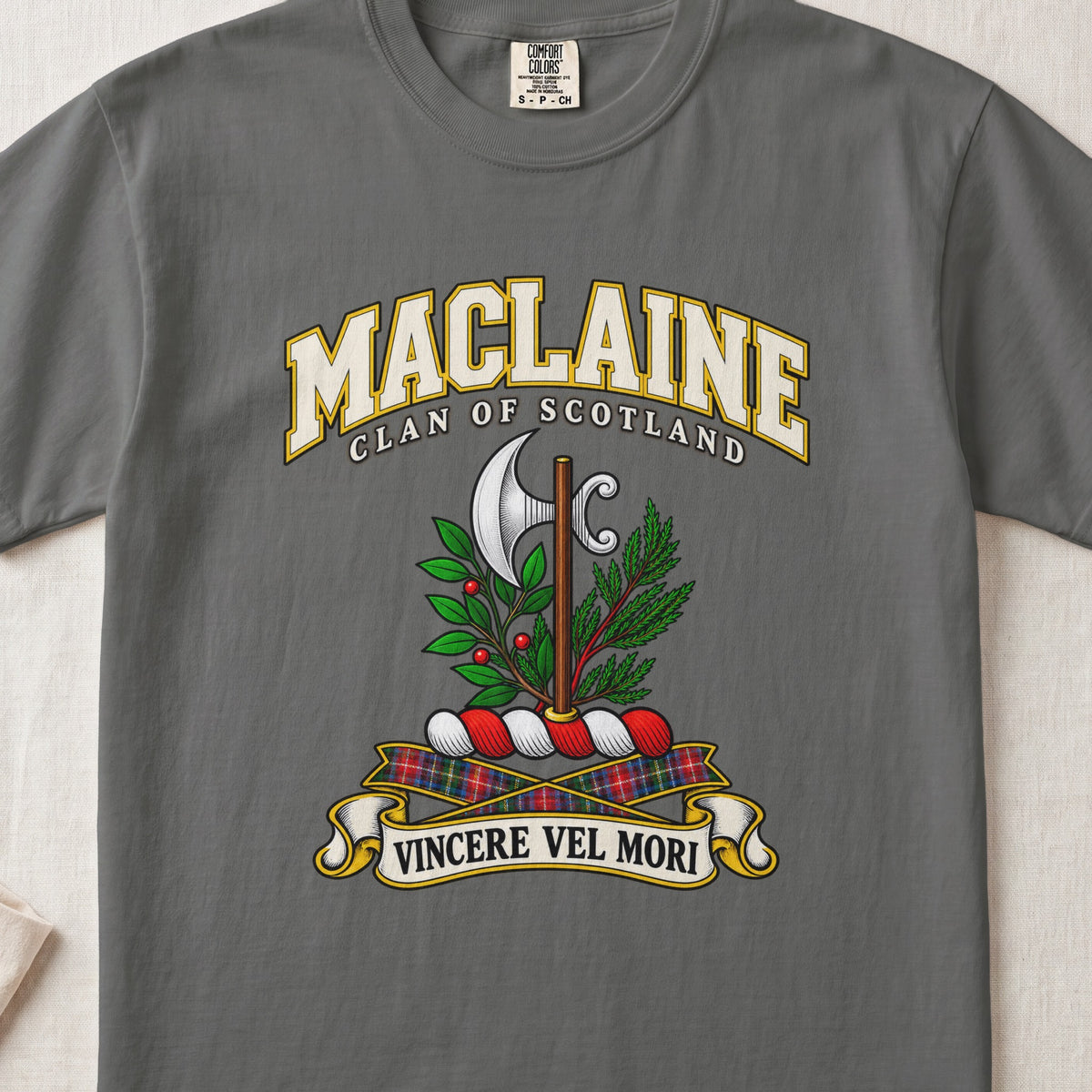 MacLaine Scottish clan T-shirt in Pepper, front view with a silver axe framed by green foliage and motto banner.
