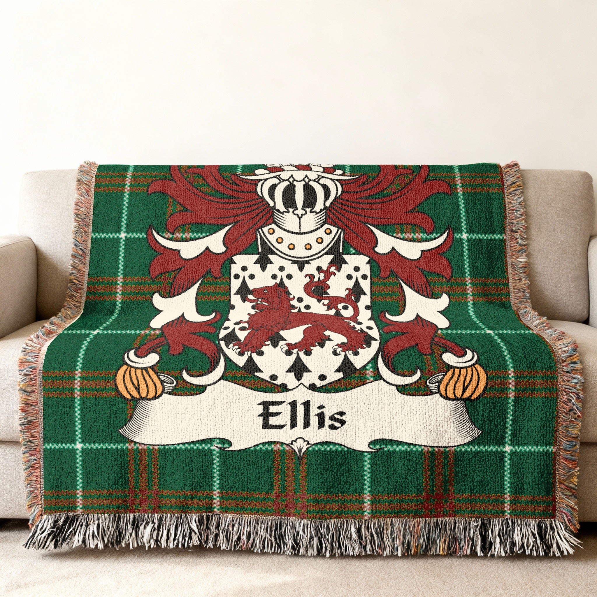 Green plaid throw blanket featuring the Ellis family crest with a lion.