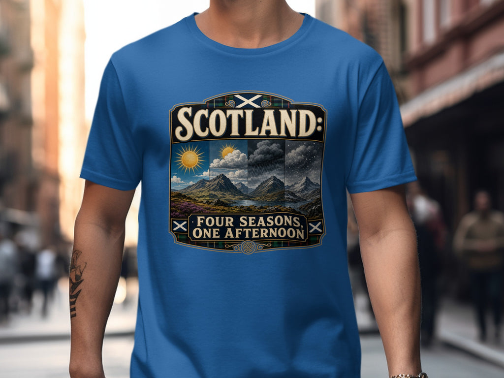 Blue t-shirt with "Scotland: Four Seasons, One Afternoon" graphic and landscape.