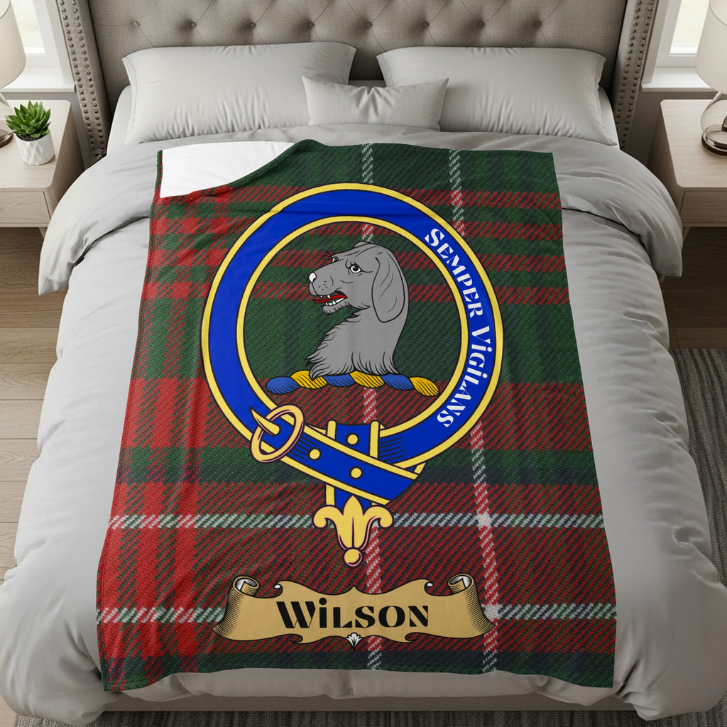 Wilson clan crest and name on red and green tartan throw