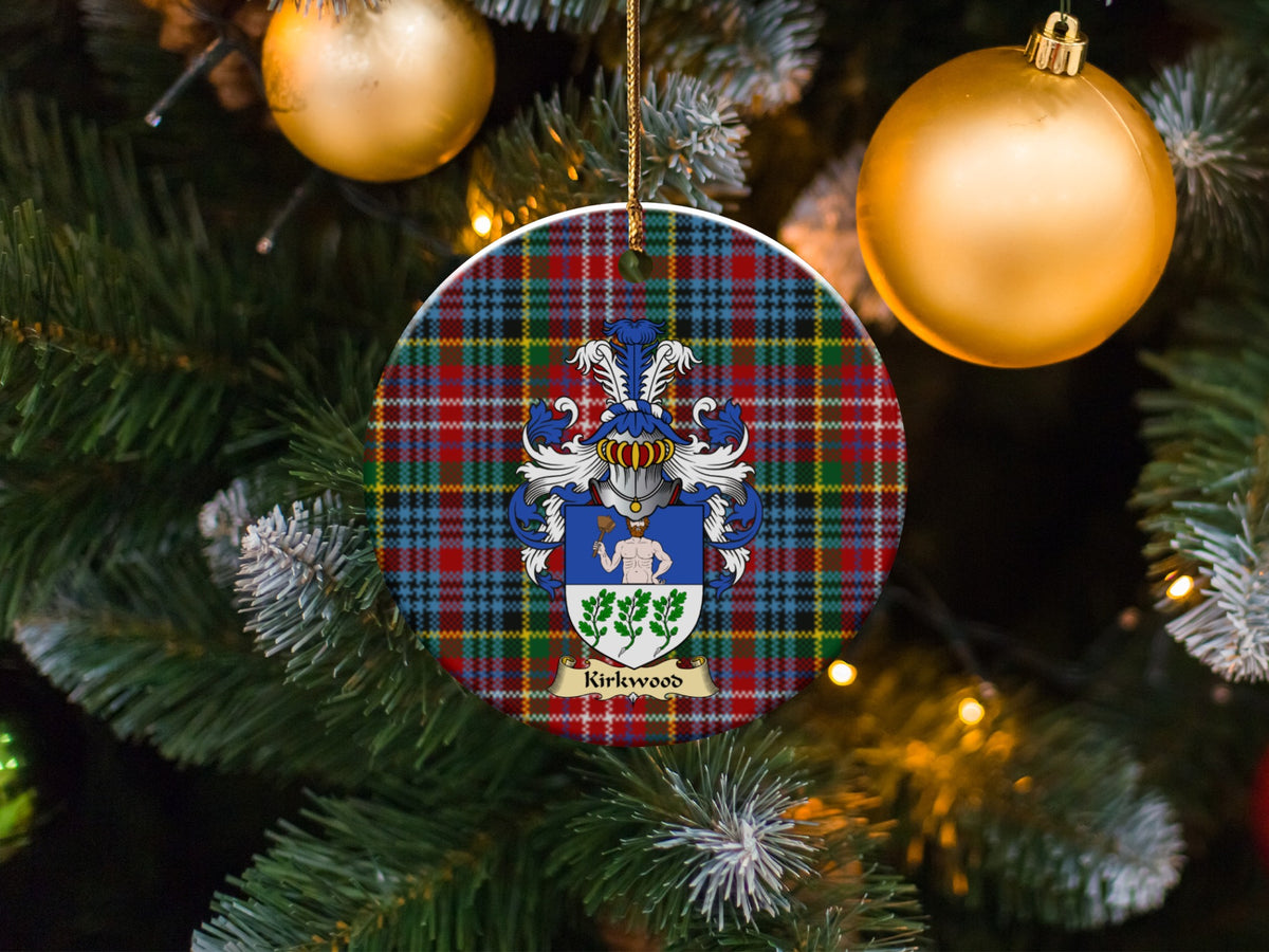 Kirkwood family emblem ceramic Christmas ornament with Caledonia tartan background in festive holiday décor